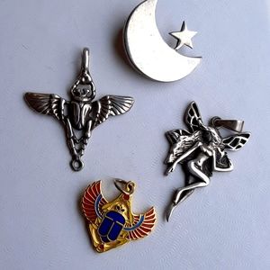 Lot of four pendants, moon and star, fairy, Egyptian scarabs, sterling & enamel